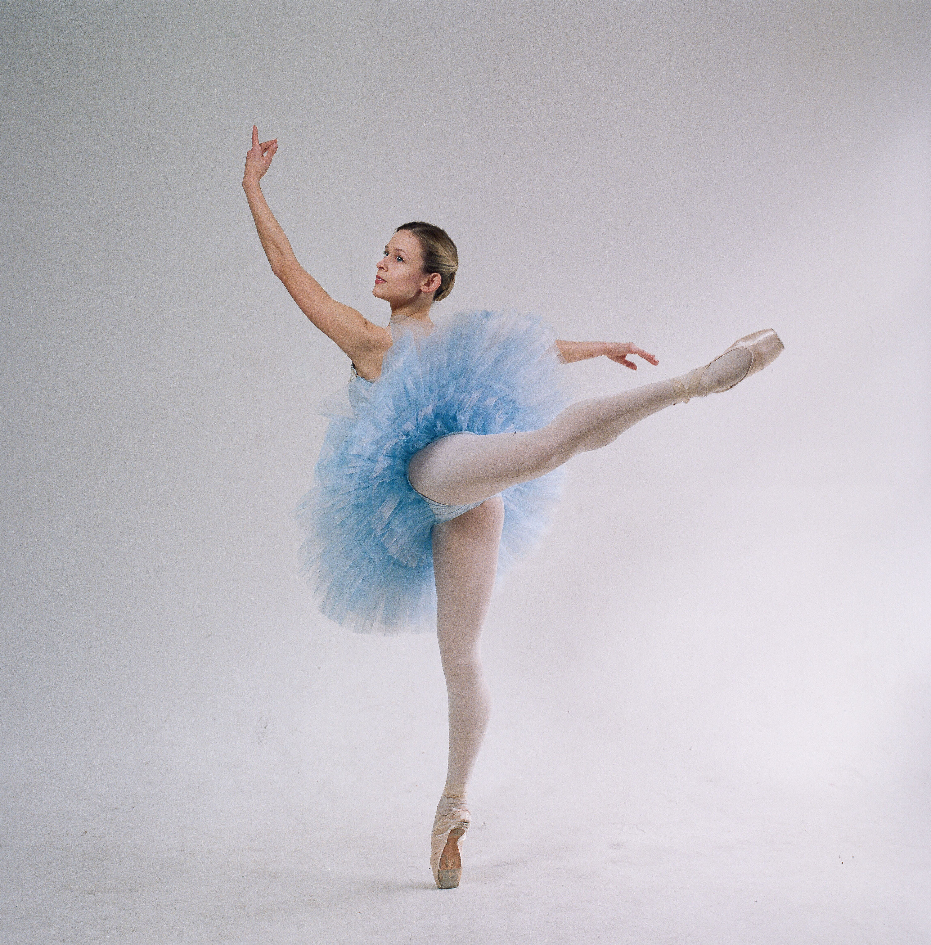 Ballerina in blue performing solo at an event